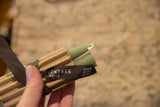 Sage green beeswax taper candles, showing 