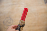 Coral Beeswax Taper Candles, hand-poured and wrapped with a Greentree Home ribbon.