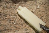 Square cream beeswax taper candles with branded Greentree Home ribbon.