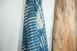 Vintage African indigo textile, hand-dyed stripe and dot patterns with visible repairs.