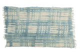 Vintage hand-woven African indigo textile throw featuring white batik stripe and dot patterns.
