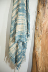 Fringed bottom and draped vintage indigo batik African textile with hand-dyed patterns.