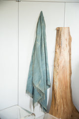 Softly draped vintage indigo African textile with subtle dye variations and fringed ends.