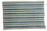 Collectible vintage African indigo textile throw, hand-woven with blue and natural stripes.