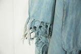Vintage denim indigo African textile with intricate hand-knotted fringe detail.