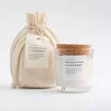 Eucalyptus and Lavender soy candle in clear glass with cork lid.