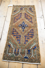Distressed Oushak runner corner, geometric design with even wear to knot heads, secured fringe.