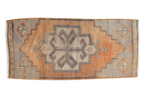 Distressed Oushak rug with apricot and silver stepped medallion and pinwheel corners. 1'6