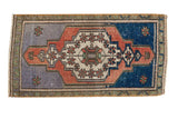Distressed Oushak rug mat, central ivory medallion, slate blue and royal blue field.