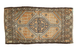 Distressed Oushak rug with geometric medallion and serrated panels in burnt orange, grey, and ivory.