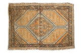Distressed Oushak rug with pale burnt orange medallion, geometric serrated panels, 1'10