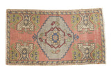 Distressed Oushak rug with pale rose field, silver medallion, stylized motifs, 1'9