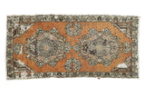 Distressed vintage Oushak runner with ornate double medallions in terracotta orange, silver, brown, 1'10