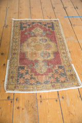 Distressed Oushak rug corner, geometric floral spandrel, securely finished side, soft hues.