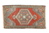 Distressed Oushak rug, central medallion, abrashed madder root red rust and oxidized silver.