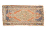 Vintage distressed Oushak rug mat runner, terracotta medallion, faded blue field.