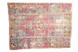Distressed vintage Oushak rug with stepped rams horn medallion, aubergine, pale royal blue, and antique ivory.