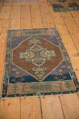 Vintage distressed Oushak rug corner, stepped medallion, chocolate brown, aqua green blue.