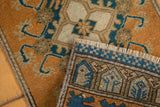 Distressed terra cotta and navy Oushak rug pile with intricate hand-knotted reverse.