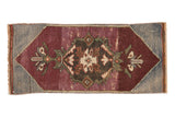 Distressed Oushak rug mat with central Rococo palmette medallion in aubergine and slate. 1'2