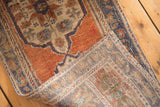 Intricate hand-knotted foundation and secured end of a vintage distressed Oushak runner.