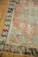 Distressed vintage Oushak rug runner border detail, geometric design in blush, seafoam, and faded blue.