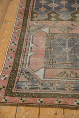 Vintage Oushak runner detail with blush, dark chocolate borders and time-softened denim blue field.
