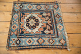 Angled view of a late 19th-century Kurdish bagface, highlighting its oversized central palmette.