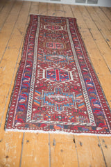 Karaja runner's white fringe and classic hook and latch geometric motifs in cherry red and sky blue.