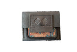 Leather and Rug Fragment Coin Purse featuring dark textured leather and colorful geometric rug remnant.