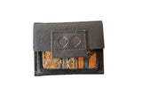 Dark brown leather coin purse with orange and blue patterned rug fragment. 5x4.