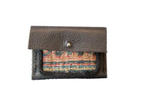Dainty Rug Fragment Wallet with dark brown leather and multi-colored woven textile.