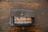 Dainty Rug Fragment Wallet: pebbled leather flap, silver snap, woven red, blue, cream textile.