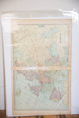 Cram's 1907 Europe map detail, revealing horizontal tear and faded pastel landmasses.
