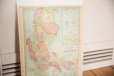 The physical 1907 Cram's map of Luzon, showing its warm paper patina and pastel coloring.