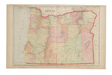Cram's 1907 Map of Oregon, featuring aged hues, detailed counties, and geographic features.