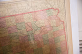 Aged paper detail of Cram's 1907 Kansas map, highlighting central and eastern counties.