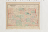 Vintage Cram's 1907 map of North Dakota, age-toned paper with muted counties and red border.