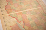 Angled view of the central seam and aged paper texture on the 1907 Illinois map.