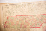 Cram's 1907 Map of Tennessee detailing red state border and aged pastel county divisions.
