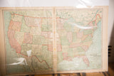 Antique 1907 map of the United States showing the full two-page spread and worn center fold.