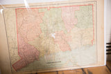 Middle-right portion of Cram's 1907 Connecticut map with aged pink and green tones, plus a tear.