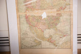 Cram's 1907 North America map showing its aged paper, time-softened colors, and a central area of loss.