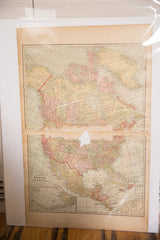 Cram's 1907 Map of North America showing its full two-part layout with tears and age discoloration.