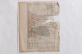 Cram's 1907 world map, North Polar Regions, with visible tears and aged tones.