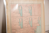 Angled view of an antique 1907 US map, showing time-softened paper and colored states.