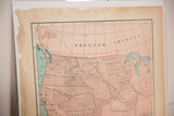 Angled view of the 1907 Louisiana Purchase map, showing territories and aged paper.
