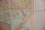 Cram's 1907 atlas map detail of New Zealand and Fiji with muted vintage colors.