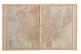 Full two-page spread of the 1907 Russia map, with pastel regions and natural paper patina.