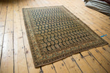 Antique Haji Jalili Tabriz rug featuring finely woven allover boteh design in dark navy and antique ivory.